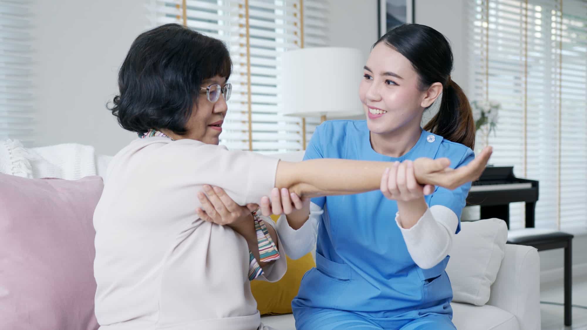 nurse physiotherapy worker at home in rehabilitation therapy service
