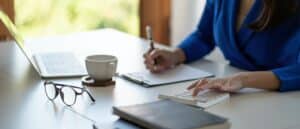 accounting is recording the company's financial growth statistics using calculator for reviewing and